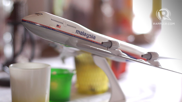 PLANE FULL OF LOVED ONES. A model airplane sits on top of the television in the Pabellon house