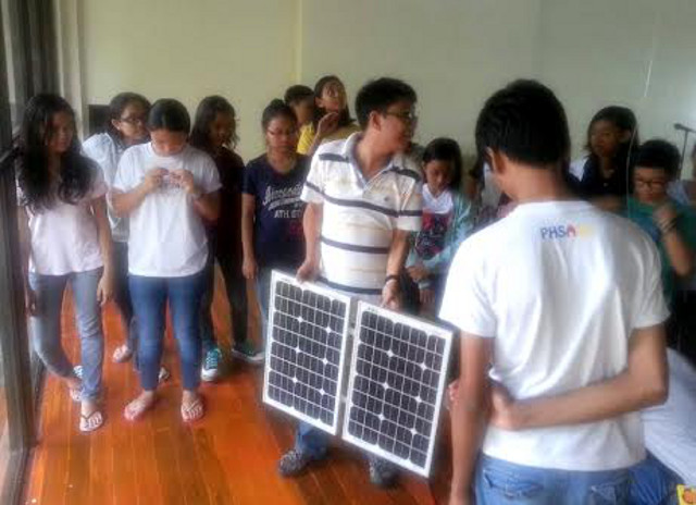 SOLAR TO THE RESCUE. Frederick Epistola installs solar panels in student dormitories of Philippine High School for the Arts in Laguna. Photo courtesy of Frederick Epistola