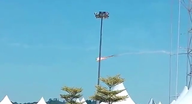 An Indonesian Woongbi plane seen on fire just seconds after colliding with another plane in Langkawi, Malaysia, on March 15, 2015. Screengrab from YouTube video uploaded by user Plane Crashes.
