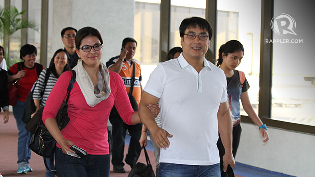 POST-VACATION. Senator Bong Revilla arrives in Manila with wife Cavite Rep Lani Revilla after his indictment over the pork barrel scam. Photo by Jedwin M. Llobrera​