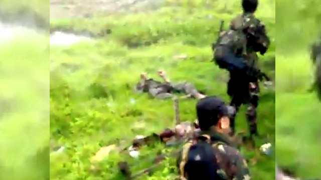 Screenshot of video of alleged soldiers involved in summary execution