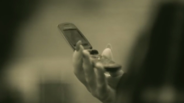 Adele using flip phone Hello music video | Screengrabbed  from Hello music video from Youtube Vevo