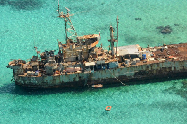 PHILIPPINES' GUARDIAN. An aerial view shows a Philippine Navy vessel that has been grounded since 1999 to assert their nation's sovereignty over Ayungin Shoal, a remote South China Sea reef also claimed by China, on March 29, 2014. Photo by Jay Directo/AFP