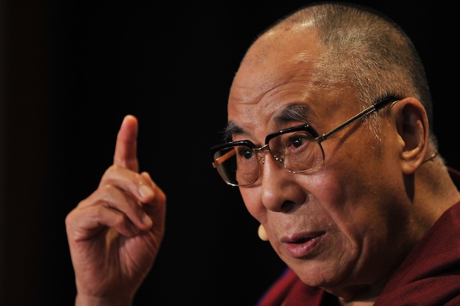 PEACE. The revered Tibetan leader makes the call on his 79th birthday. File photo by Paul Miller/EPA
