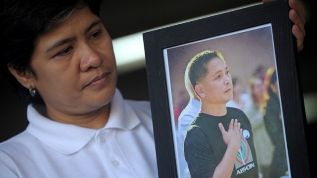 MASTERMINDS MISSING. The Committee to Protect Journalists says last year's conviction of the gunman of journalist Gerry Ortega (photographed on the right) was a 'partial victory' against impunity. His widow Patricia is in this photo taken on February 16, 2011. Photo by Noel Celis/AFP 