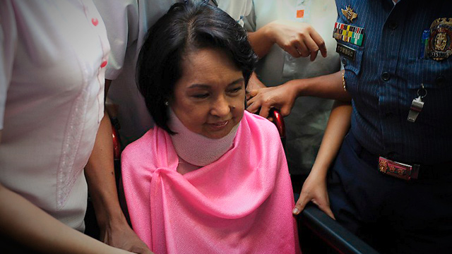 EMBATTLED. Former president Gloria Macapagal-Arroyo continued to face court cases and health problems in 2013. File photo by Ted Aljibe/AFP