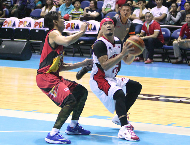 Mark Caguoia attacks the basket against Alex Cabagnot of San Miguel. Photo by Nuki Sabio/PBA Images