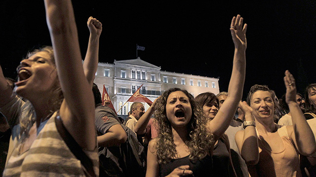 Supporters of the 'No' campaign react after the results of the referendum in Athens, Greece, 05 July 2015. Greek voters in the referendum were asked whether the country should accept reform proposals made by its creditors. EPA/ORESTIS PANAGIOTOU