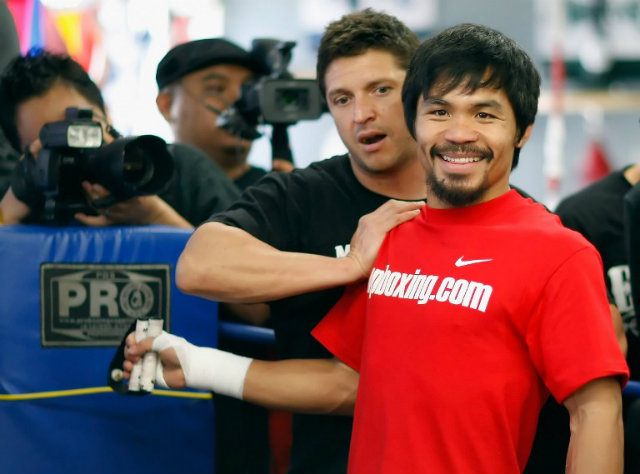 Alex Ariza made his name working for Manny Pacquiao. Now he's working with Pacquiao's arch rival Floyd Mayweather. Photo by Jeff Gross/Getty Images/AFP