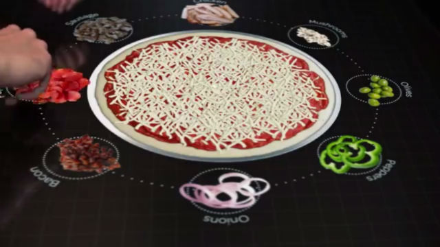 DIGITIZED. Could the future of pizza ordering be this fun? Image still from Youtube user pizzahut's video