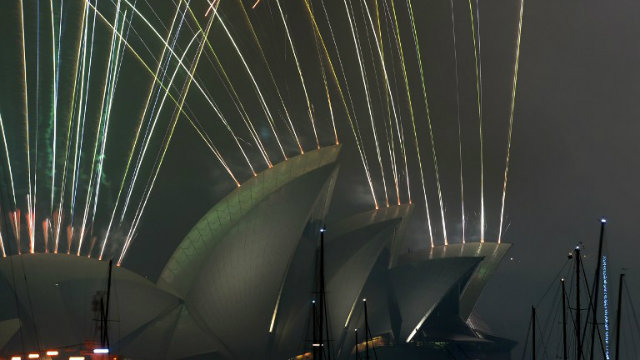 FIREWORKS.   New Year's Eve fireworks erupt over Sydney's iconic Harbour Bridge and Opera House during the traditional fireworks show held at midnight on December 31, 2014. Photo by Peter Parks/AFP