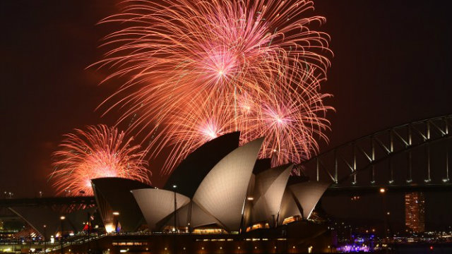 FIREWORKS. New Year's Eve fireworks erupt over Sydney's iconic Harbour Bridge and Opera House during the traditional early family fireworks show held before the main midnight event on December 31, 2014. Photo by Saeed Khan/AFP